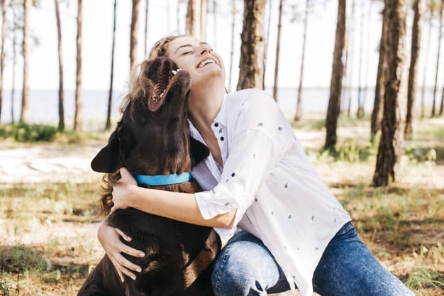 young woman show love to dog